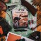 A stack of Project Upland Magazines with hunting gear