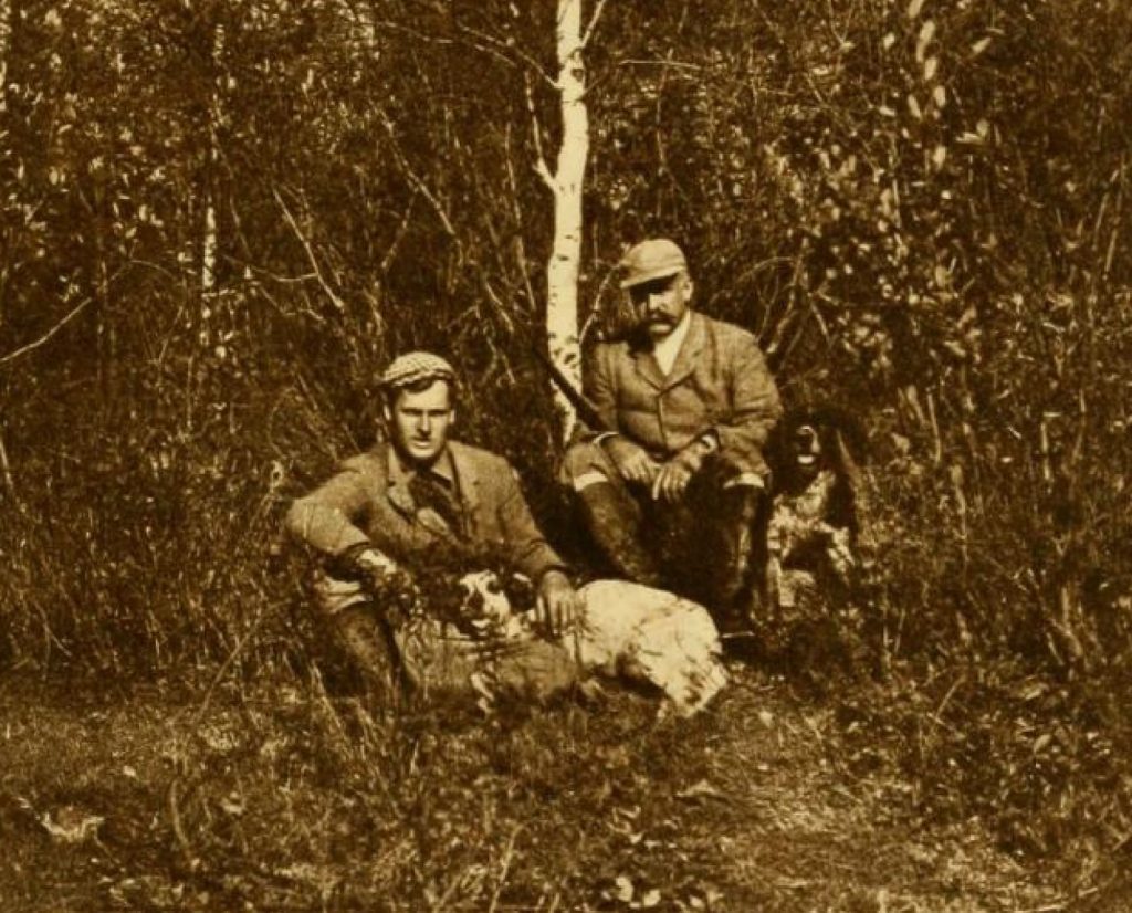Vintage photo of Edmund Davis using dog bells while hunting.